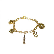 close up of i love new york bracelet charms including nyc apple pretzel and empire state building by Love Lisa