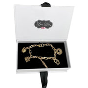i love new york charm bracelet displayed in black gift box with gold charms by Love Lisa