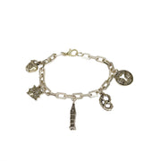 close up of silver I love new york bracelet charms including nyc apple pretzel and empire state building by Love Lisa