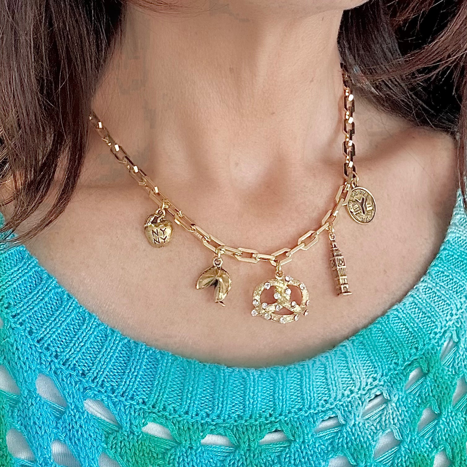 i love ny necklace with apple pretzel subway token and empire state building charms