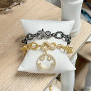 love lisa silver infinity clasp chain bracelet shown styled on wrist with rope chain texture and sparkly infinity clasp