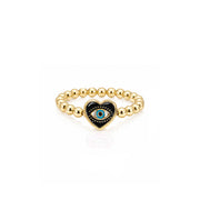 Isabella Enamel Evil Eye Heart Stretch Ring in black with polished gold beads and enamel heart evil eye centerpiece