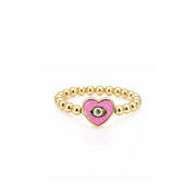 Love Lisa Isabella Enamel Evil Eye Heart Stretch Ring in pink with polished gold beads and heart-shaped evil eye centerpiece