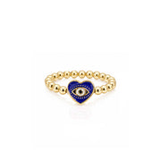 Isabella Enamel Evil Eye Heart Stretch Ring in royal blue with polished gold beads and enamel heart evil eye centerpiece