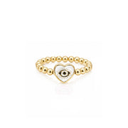 Isabella Enamel Evil Eye Heart Stretch Ring in white with polished gold beads and enamel heart evil eye centerpiece