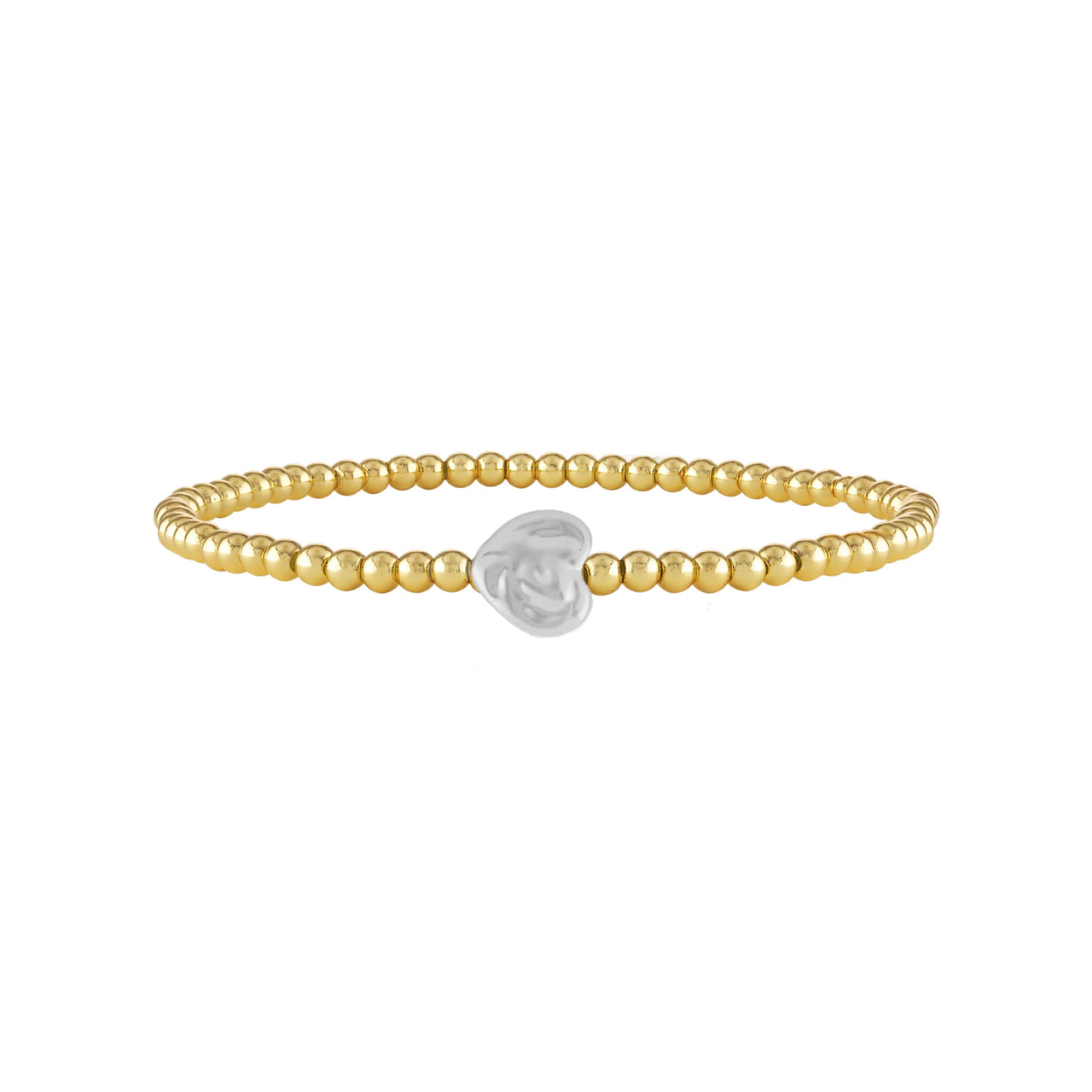 Gold stretch anklet with sculpted pearl heart charm, worn on foot at the beach