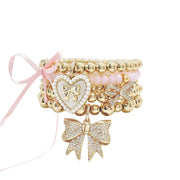 love lisa jackie pearl heart bow charm bracelet gold ivory bracelet stack with gold bow charm and heart charm