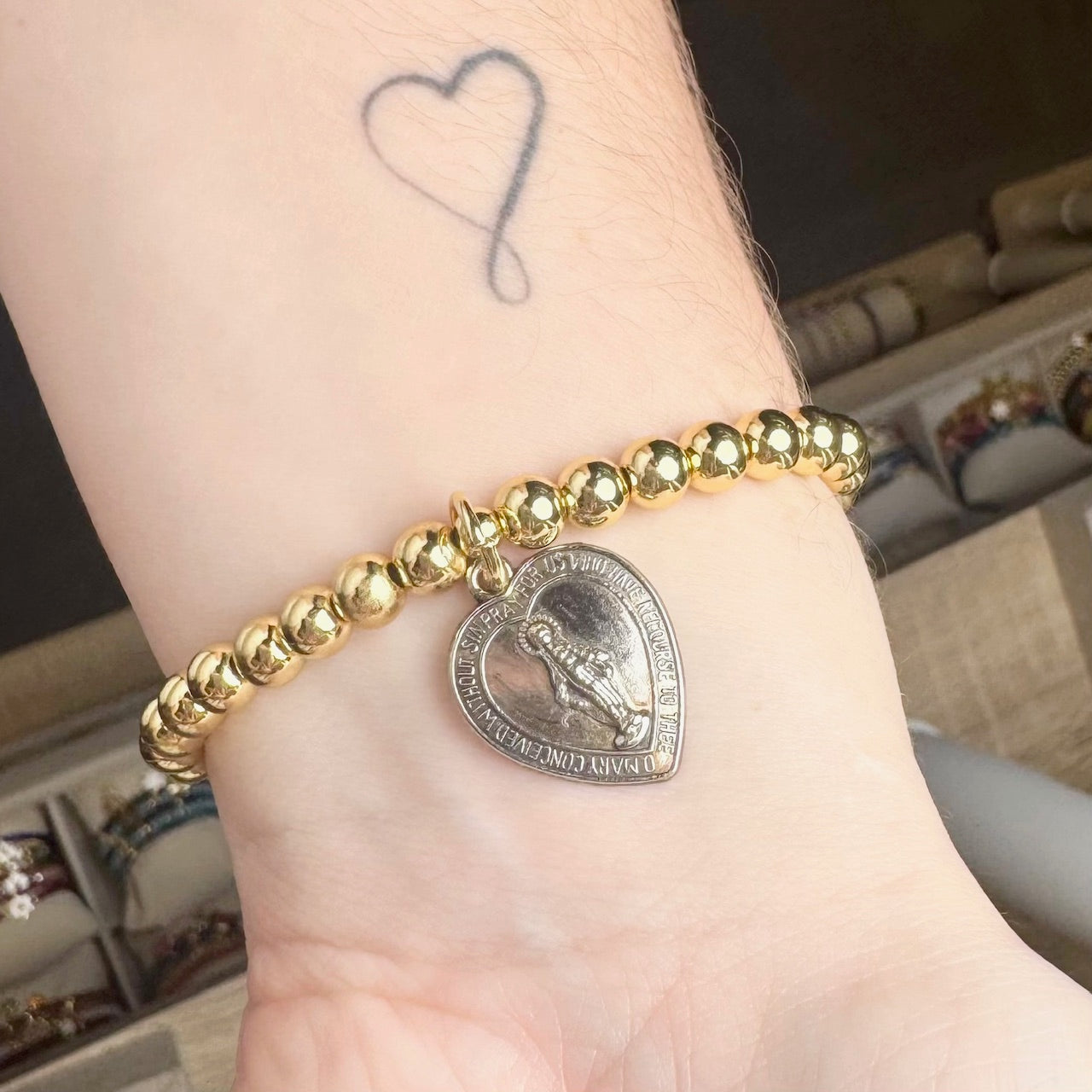 jan miraculous medal bracelet worn on wrist