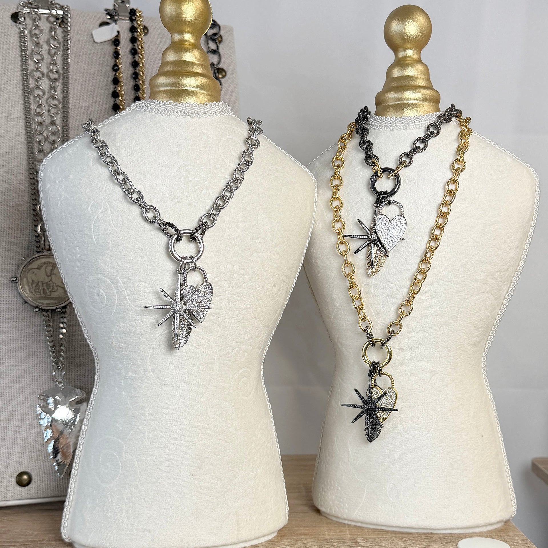 Jasmine North Star heart feather charm necklace displayed on bust mixed metal chain