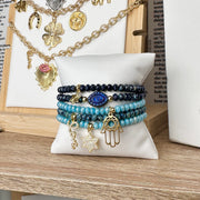 Jewish charm bracelet stack with Star of David - Evil Eye - Hamsa Hand - and Love script from Love Lisa Jewelry