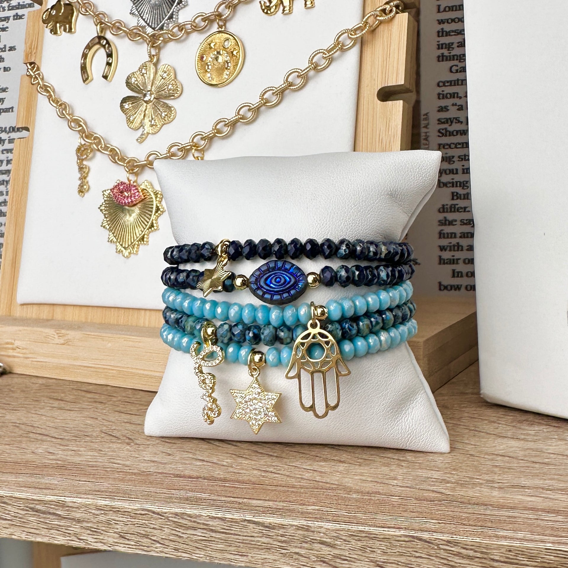 Jewish charm bracelet stack with Star of David - Evil Eye - Hamsa Hand - and Love script from Love Lisa Jewelry