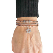love lisa laurie star of david bracelet on wrist stacked beaded bracelets with star of david charm