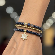 love lisa leah navy star of david beaded bracelet stack on wrist layered navy and gold bracelets with star of david charm