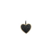 Heart-shaped pendant with black stones on a white background