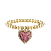 lila allure beaded heart bracelet in gold pink featuring gold tone round beads and a bright pink pave crystal heart charm on stretch band