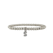 silver beaded lila bubble letter bracelet with dangling s charm shown in closeup view