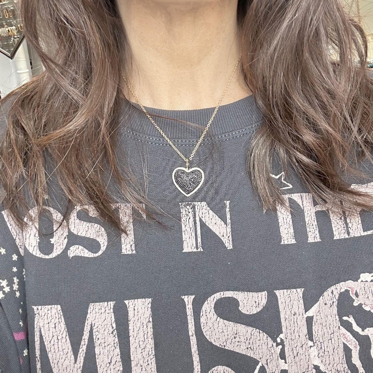 lila diamond heart necklace in black with gold chain and bold black cz heart pendant