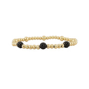 black beaded lilly pave bracelet with three gold pave accent beads on stretch band