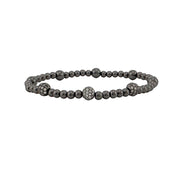 gunmetal beaded lilly pave bracelet with three gunmetal pave accent beads on stretch band