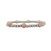 silver lilly pave bracelet with three rose gold pave beads on stretch beaded band