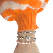 multiple silver lilly pave bracelets stacked on wrist showing shine and sparkle from pave beads