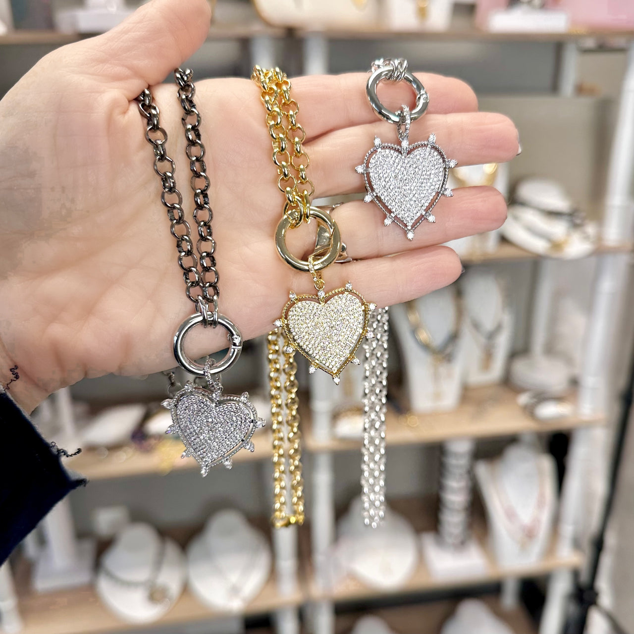 close up of lindsay cz heart link necklace in silver with sparkling charm by love lisa