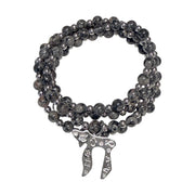 Liora Gemstone Beaded Chai Necklace with grey jasper beads, silver-tone accents, and a silver Chai to Life pendant shown coiled
