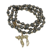 Liora Gemstone Beaded Chai Necklace with metallic pyrite beads, gold-tone accents, and a gold Chai to Life pendant shown coiled