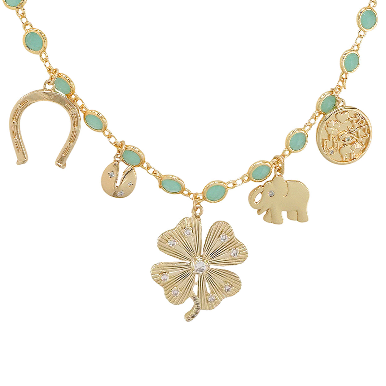 Close view of lucky clover and horseshoe charms on green stone gold tone necklace