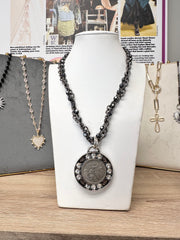 enchanted fairy necklace displayed on white stand