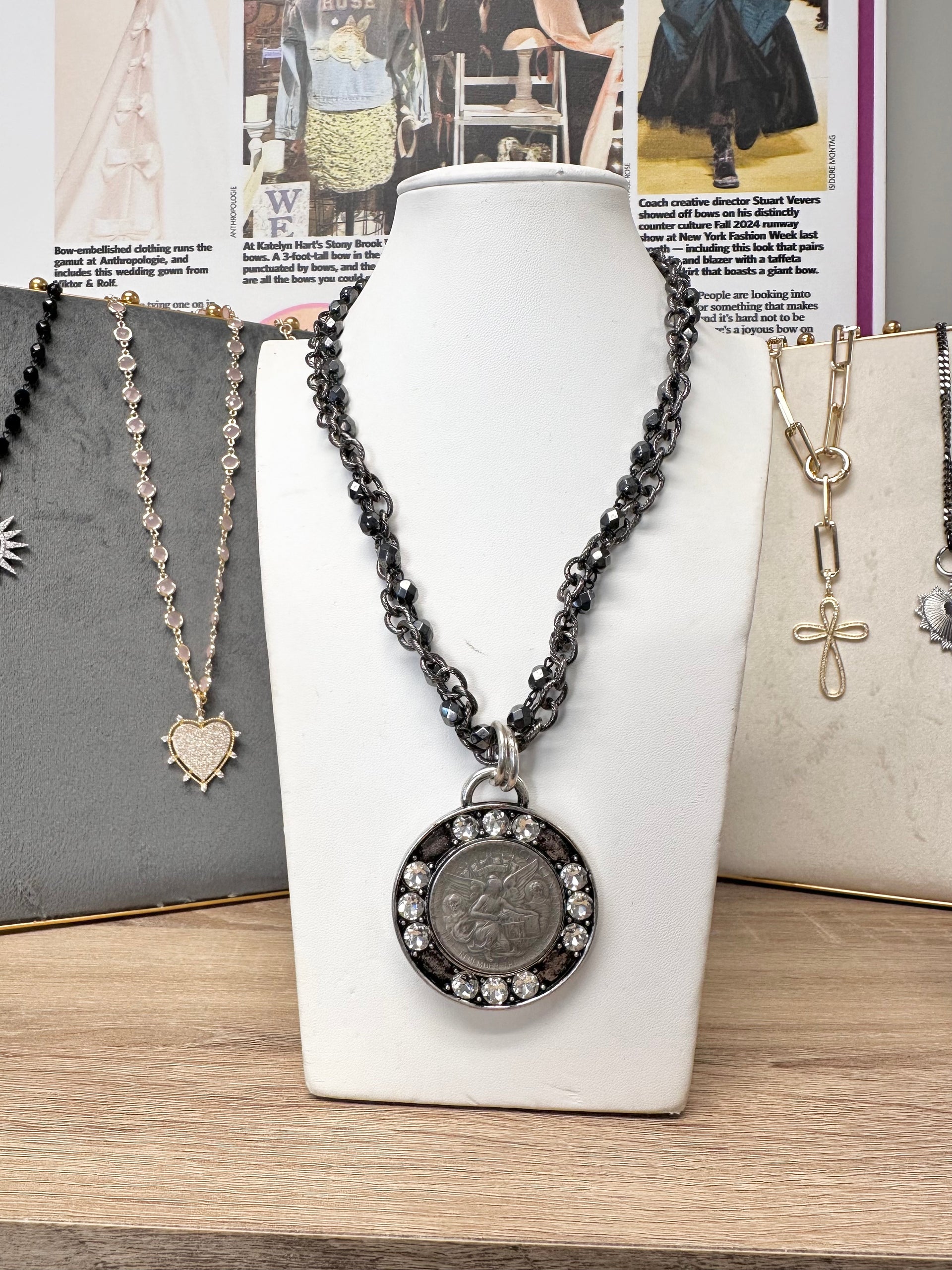 enchanted fairy necklace displayed on white stand