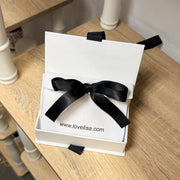 Elegant jewelry gift box styled on tabletop