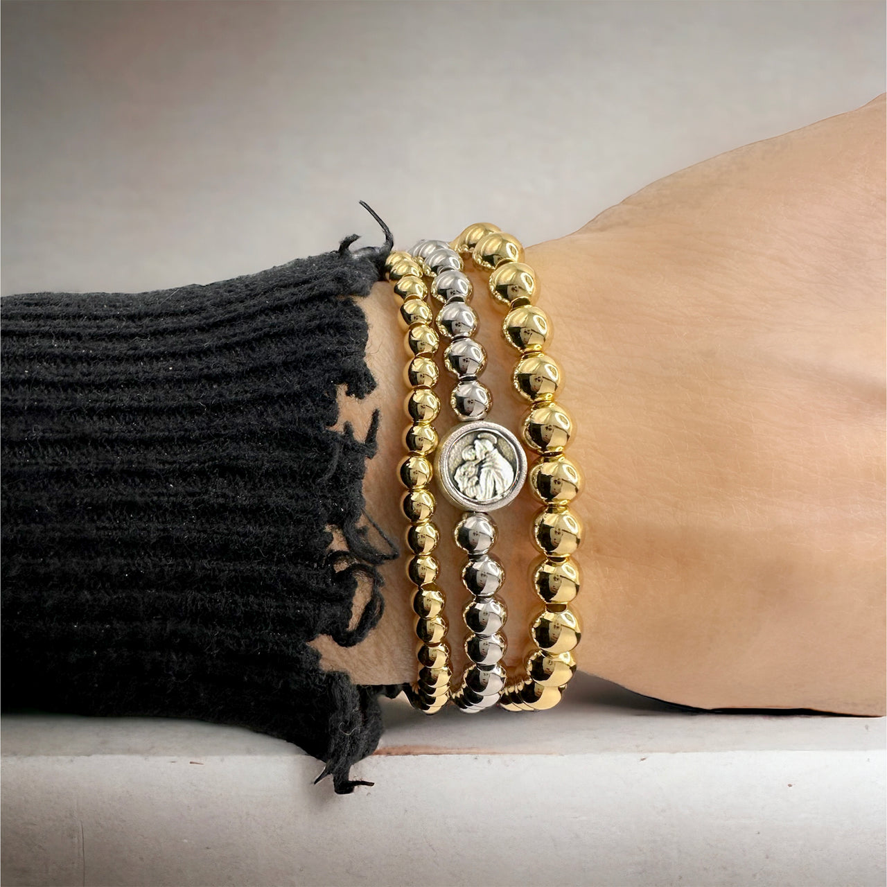 Love Lisa Subliminal Saint Anthony beaded bracelet worn on wrist womens size