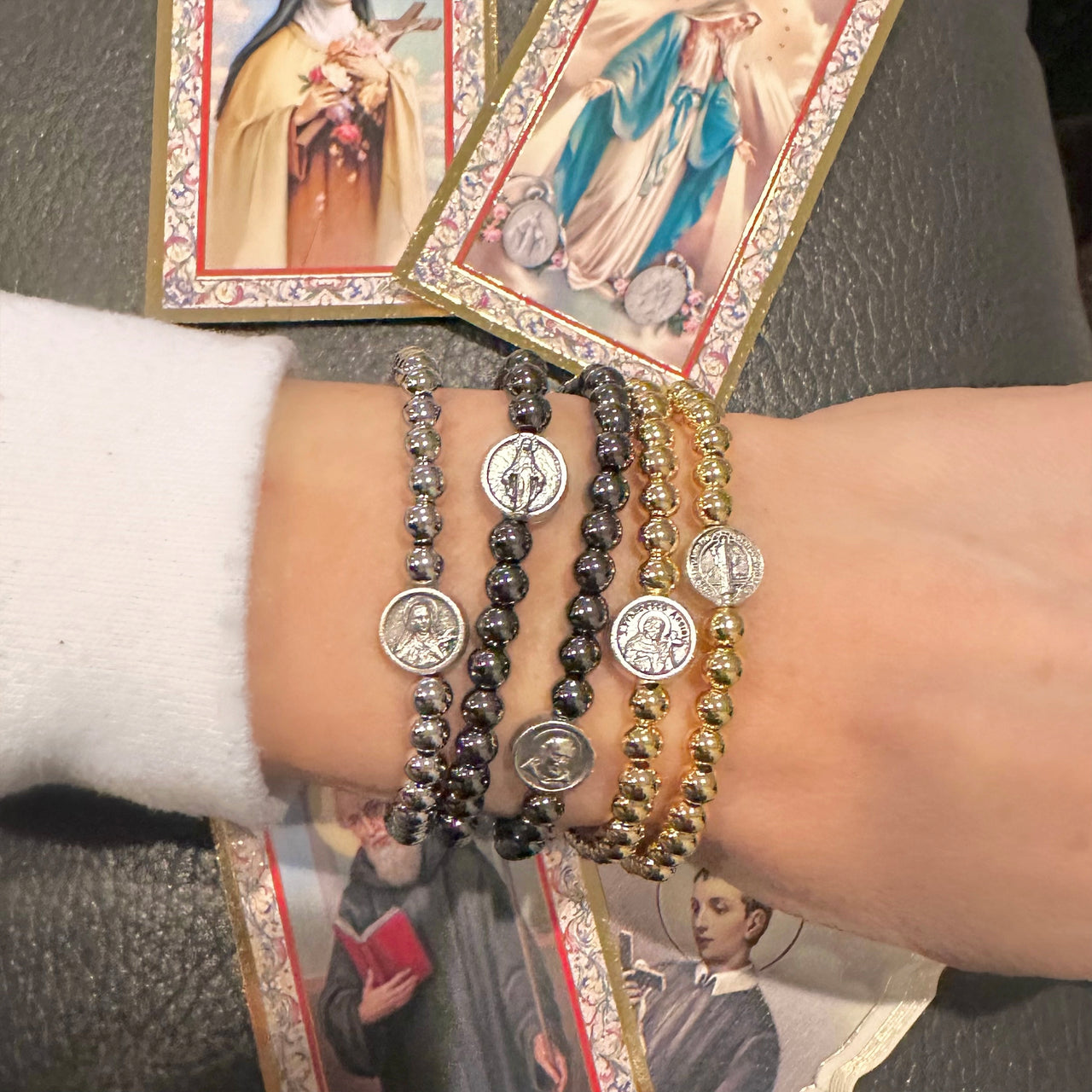 Love Lisa Subliminal Saint Francis beaded bracelet worn on wrist womens size