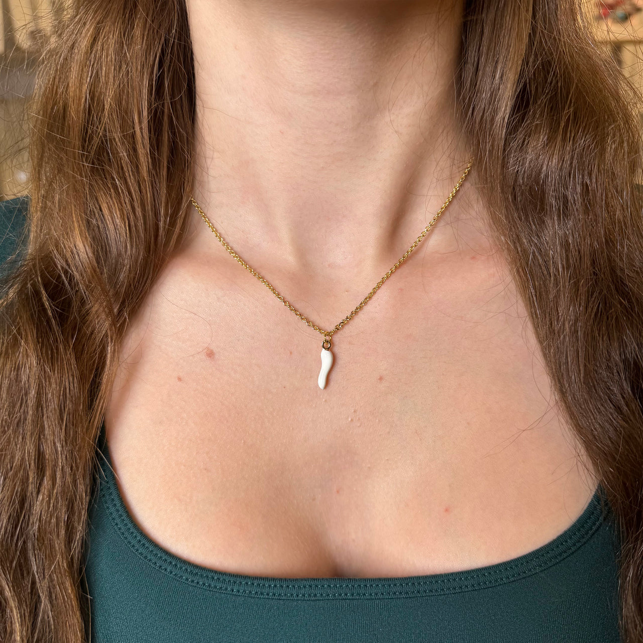 Lucia Italian Horn white gold necklace on a model