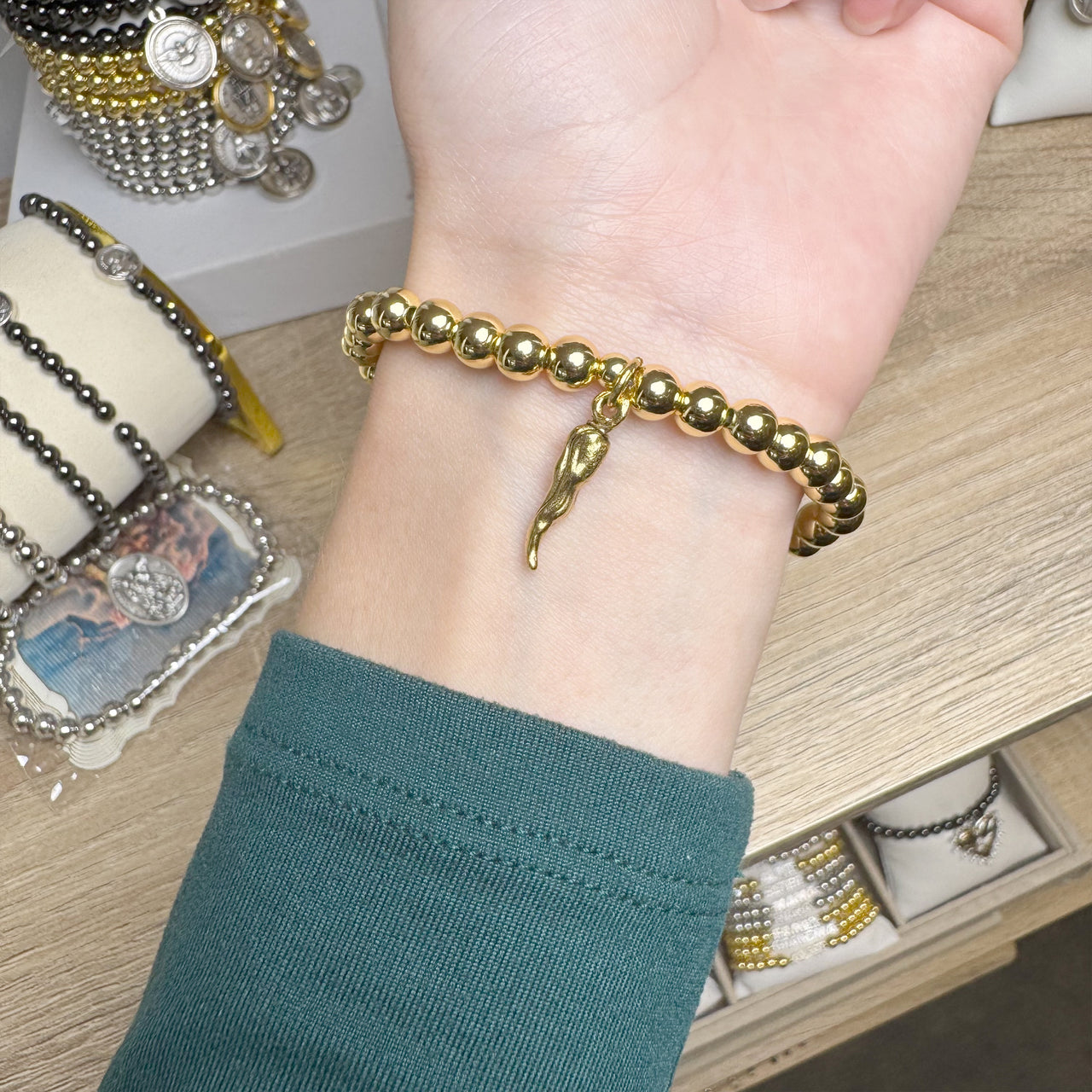 Lucia gold horn bracelet worn on wrist by Love Lisa

