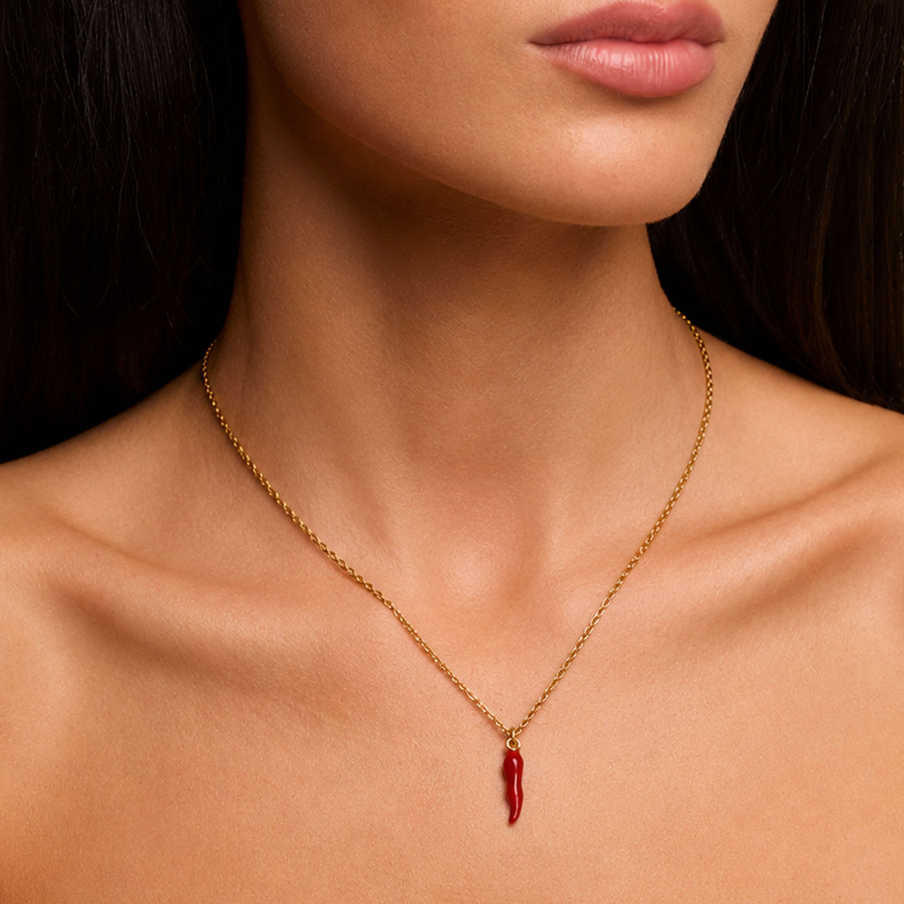 Love Lisa red Italian horn necklace worn on neck with delicate gold chain and protection jewelry styling