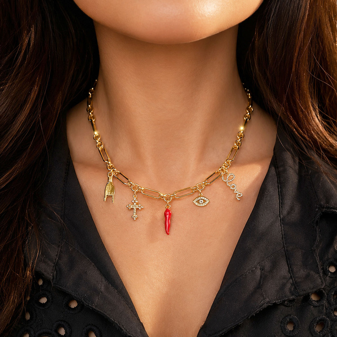 Love Lisa Luciana Italian horn charm necklace worn layered with symbolic charms on model