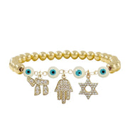 Judaica bracelet with white evil eye beads Hamsa hand Star of David Chai gold finish
