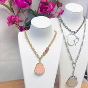 lumbini buddha necklace in pink on display