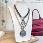 Necklace with pendants on a mannequin bust with a blurred background