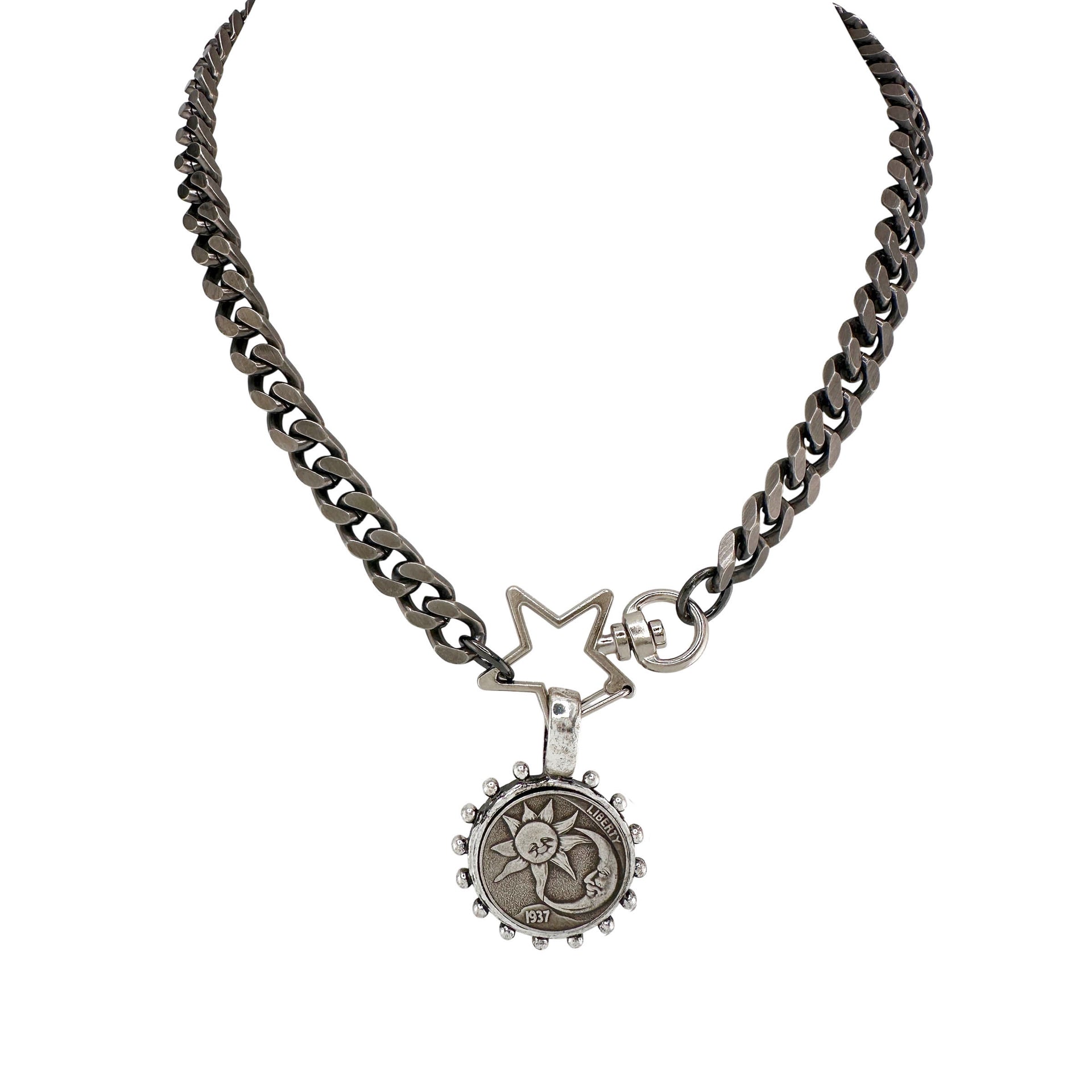 Necklace with star and circular pendant on a white background
