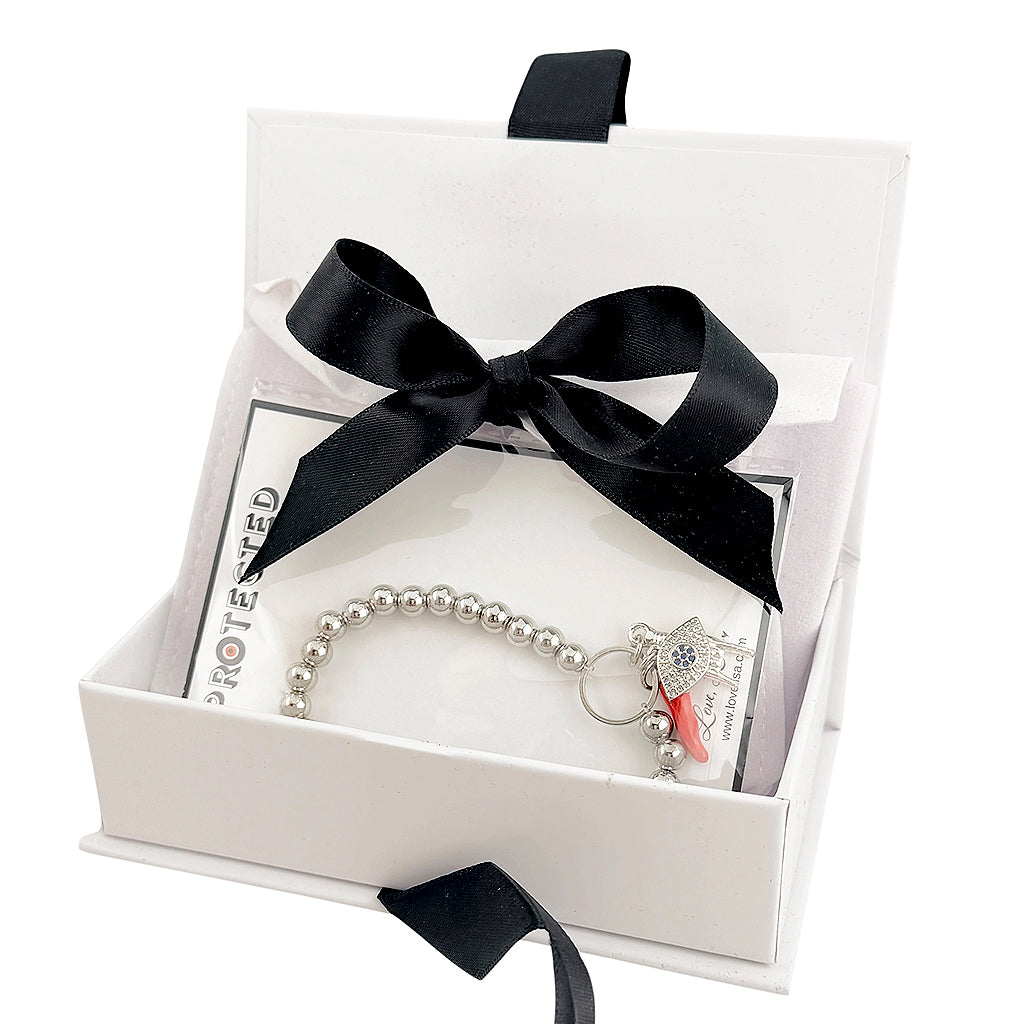 gift box with ribbon open showing bracelet inside ready to gift