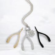 Luxe Wishbone Sparkle Charms in gold, silver, and black CZ styles on chain with clover charm