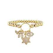 Gold stretch bracelet with Star of David Chai and Evil Eye charms