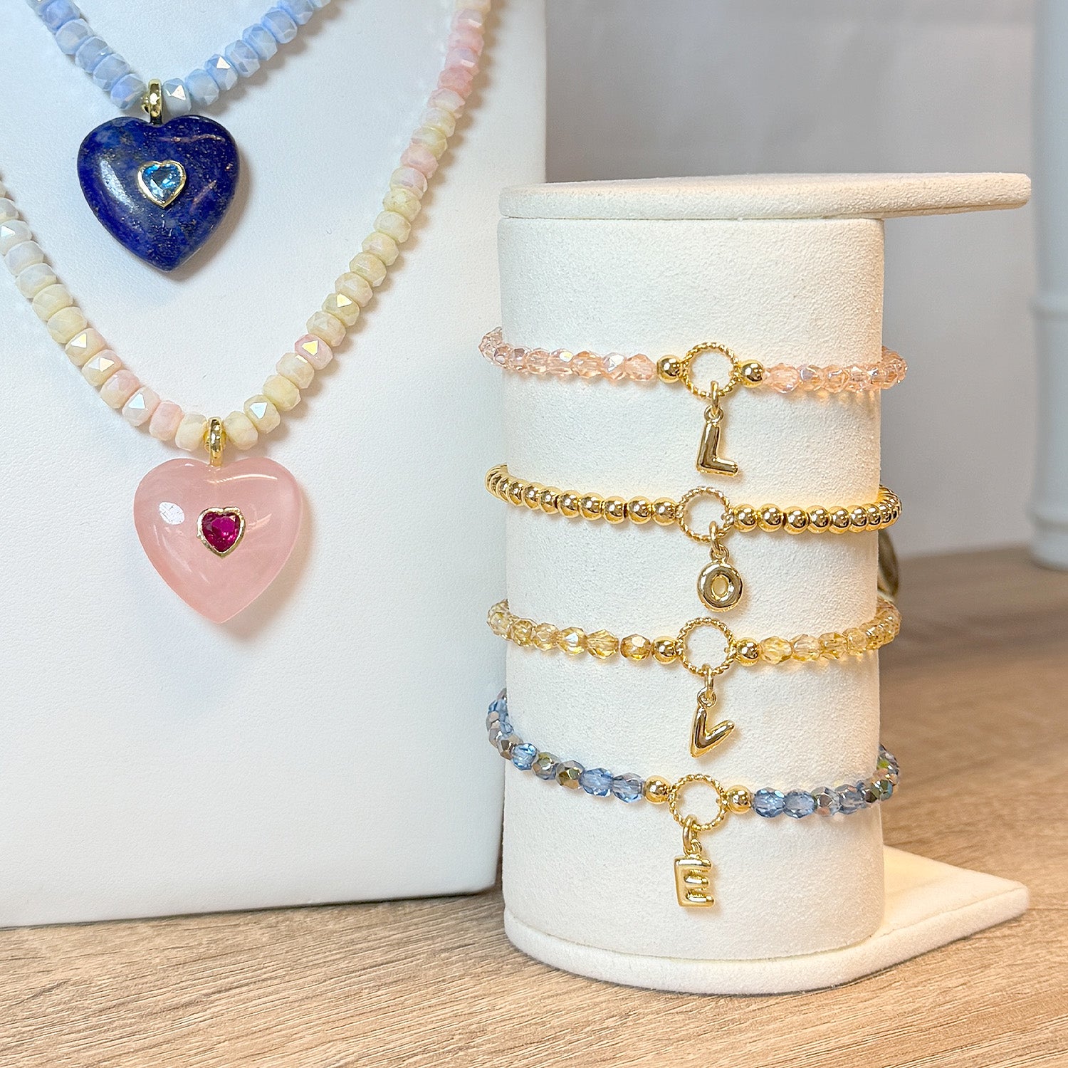 Love Lisa madison initial charm beaded bracelets shown on store display