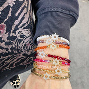 love lisa wrist wearing madison star of david bracelet red and gold tones