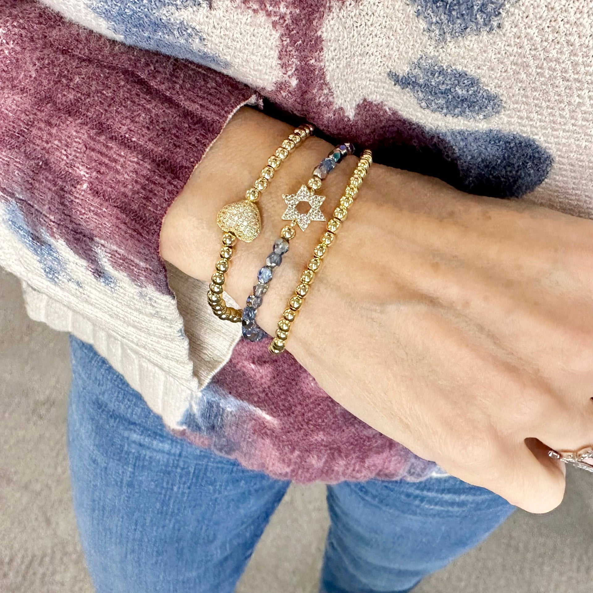 love lisa wrist wearing madison star of david bracelet with cozy sweater outfit