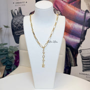 Love Lisa maeve love drop necklace gold displayed on bust showing vertical love pendant