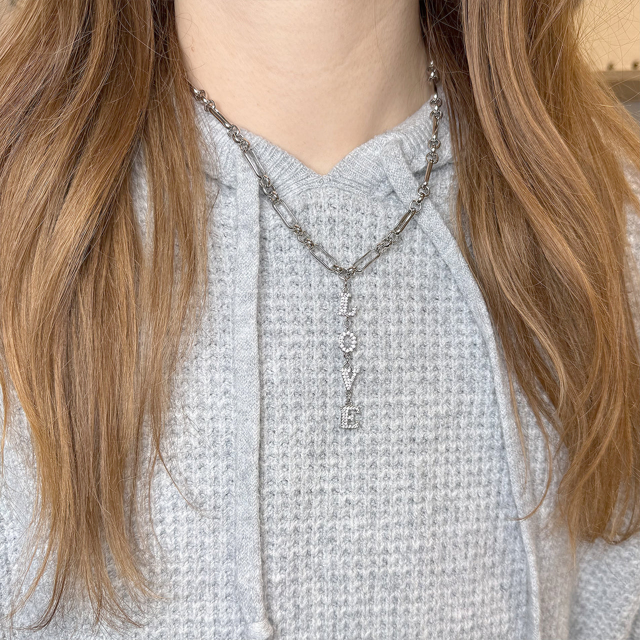Love Lisa maeve love drop necklace silver worn layered with modern chain styling